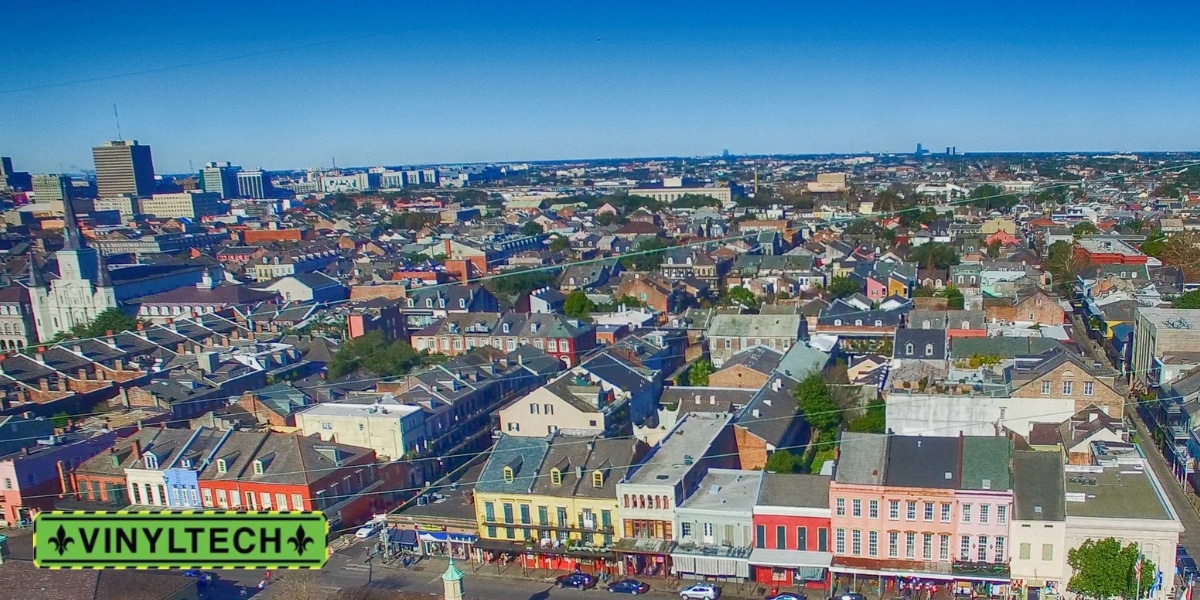 This aerial view of the French Quarter in New Orleans highlights the region's historic architecture and diverse roofing styles. With a climate prone to heavy rains and storms, durable and weather-resistant roofs are essential. Vinyltech Roofing is the trusted contractor in New Orleans, offering expert solutions to protect and preserve these iconic structures.