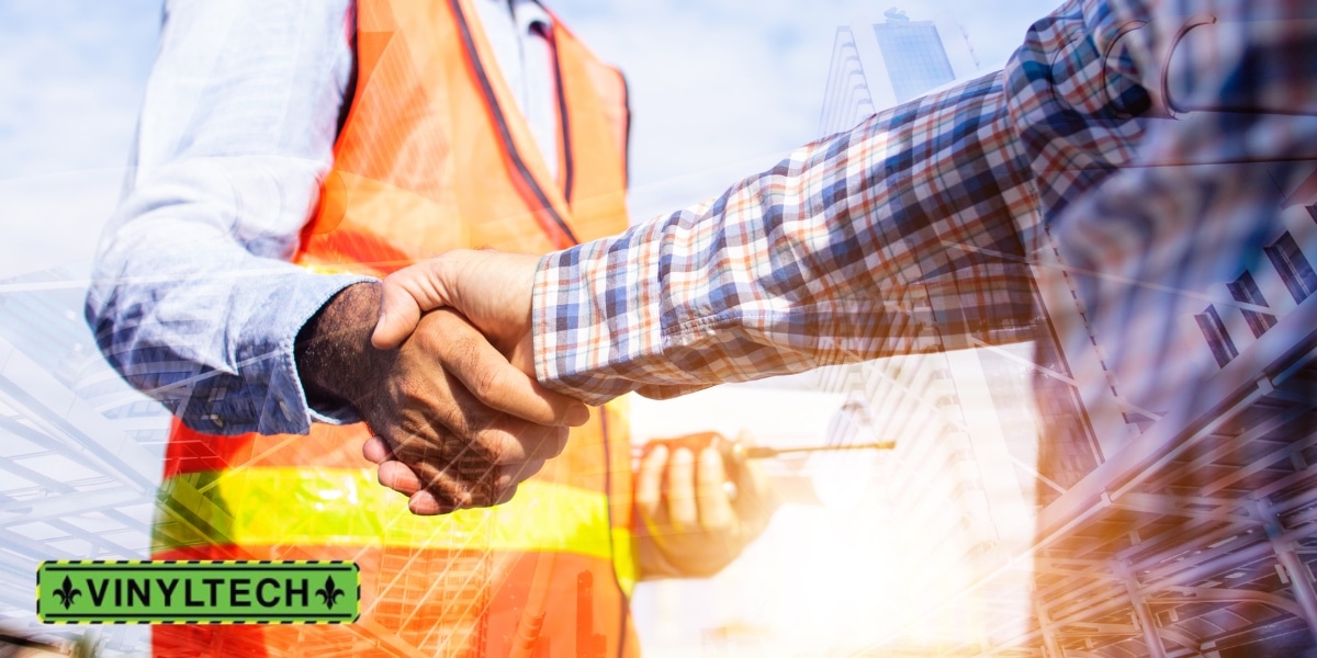 Close-up of a handshake between a construction professional in a safety vest and a business owner, symbolizing a commercial roofing agreement or partnership, featuring the Vinyltech logo.