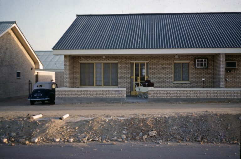 A clean, modern office interior with a company logo, representing a roofing business entity.