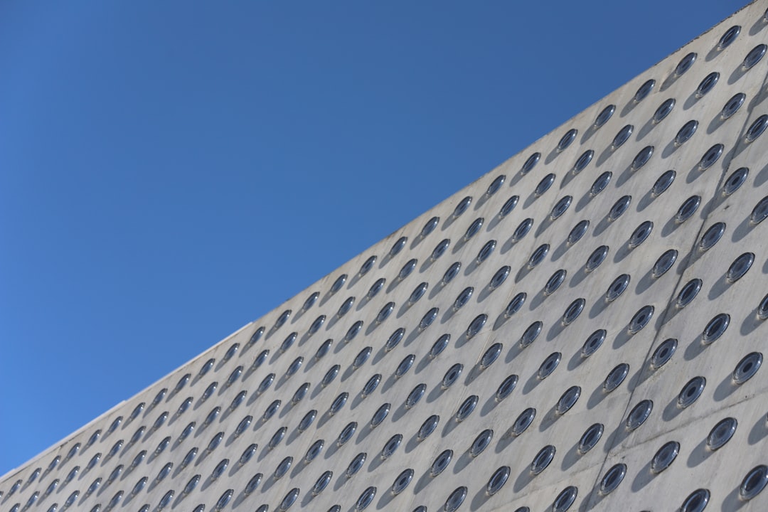 Close-up of new, clean roof shingles on a modern architectural home, emphasizing quality and recent upgrade.. Photo by Christer Lässman on Unsplash. Close-up of new, clean roof shingles on a modern architectural home, emphasizing quality and recent upgrade.