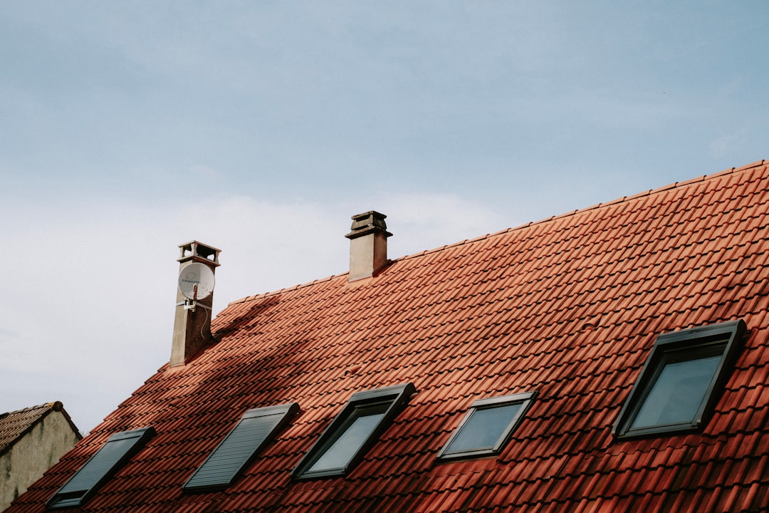 A sturdy home with a resilient roof on a sunny day, representing protection against severe weather.. Photo by Mathias Reding on Unsplash. A sturdy home with a resilient roof on a sunny day, representing protection against severe weather.